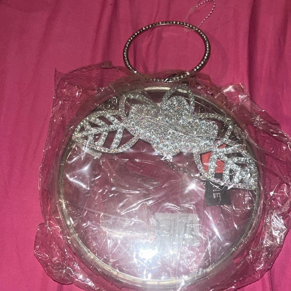 Clear classy mini hand bag with strap brand new
